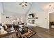 Spacious living room with a fireplace and large windows with backyard views at 4305 Red Rock Dr, Larkspur, CO 80118