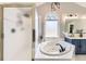 A main bathroom with a soaking tub, separate shower, vanity with double sinks, and overhead lighting at 4305 Red Rock Dr, Larkspur, CO 80118