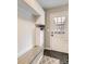 Functional mud room boasts bench seating, storage cabinets, and convenient access to the exterior at 4305 Red Rock Dr, Larkspur, CO 80118