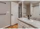 Updated bathroom featuring granite countertops, a vanity, and a shower/tub with tile surround at 500 Lashley St # 58, Longmont, CO 80504