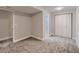 Carpeted bedroom with closet and open doorway offers flexibility for furniture arrangement at 500 Lashley St # 58, Longmont, CO 80504