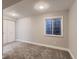 Neutral bedroom with carpet, a window, and a closet, creating a cozy and functional living space at 500 Lashley St # 58, Longmont, CO 80504