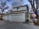 Two-story home with gray siding, garage, and manicured landscape, offering a welcoming and modern design at 500 Lashley St # 58, Longmont, CO 80504