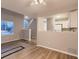 Open-concept living room featuring new floors, gray walls, updated ceiling fan, and lots of natural light at 500 Lashley St # 58, Longmont, CO 80504