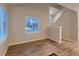 Inviting living room featuring wood-look floors, neutral paint, and an abundance of natural light at 500 Lashley St # 58, Longmont, CO 80504