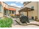 Inviting courtyard space with a BBQ grill and patio seating for outdoor dining and relaxation at 485 S Logan St # 10, Denver, CO 80209