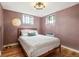 Cozy bedroom features warm lighting, hardwood floors, and large windows at 485 S Logan St # 10, Denver, CO 80209