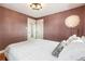 Cozy bedroom features warm lighting, hardwood floors, and closet doors at 485 S Logan St # 10, Denver, CO 80209