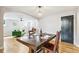 Dining area with hardwood floors, seamlessly connects to the living room for easy flow at 485 S Logan St # 10, Denver, CO 80209