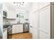 Bright kitchen featuring stainless steel appliances, granite countertops, and white cabinets at 485 S Logan St # 10, Denver, CO 80209