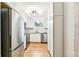 Bright kitchen featuring stainless steel appliances, granite countertops, and white cabinets at 485 S Logan St # 10, Denver, CO 80209
