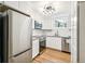 Bright kitchen featuring stainless steel appliances, granite countertops, and white cabinets at 485 S Logan St # 10, Denver, CO 80209