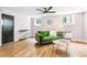 Comfortable living room with hardwood floors, bright natural light, and cozy green couch at 485 S Logan St # 10, Denver, CO 80209