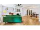 Spacious living room with hardwood floors, fireplace, and open layout into dining area at 485 S Logan St # 10, Denver, CO 80209