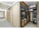 Hallway featuring numbered storage units with secure doors, offering ample space for belongings at 485 S Logan St # 10, Denver, CO 80209