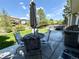 Backyard patio area with a table, chairs, umbrella, grill and a hot tub at 16063 E 106Th Ct, Commerce City, CO 80022