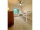 bedroom featuring an elevated bed, dresser, and large window at 16063 E 106Th Ct, Commerce City, CO 80022