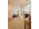 Open-concept area with light floors, a dining table, and a piano under vaulted ceilings at 16063 E 106Th Ct, Commerce City, CO 80022