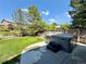 Backyard featuring a well-maintained hot tub, green lawn, and partial fencing at 16063 E 106Th Ct, Commerce City, CO 80022