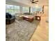 This spacious living room is carpeted and has large windows at 16063 E 106Th Ct, Commerce City, CO 80022