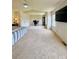 Large carpeted main bedroom with vaulted ceiling, a ceiling fan and a large walk in closet at 16063 E 106Th Ct, Commerce City, CO 80022