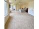 Spacious carpeted main bedroom with multiple windows, a ceiling fan and ensuite access at 16063 E 106Th Ct, Commerce City, CO 80022