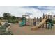 Neighborhood playground featuring multiple slides, climbing structures, and safety surfacing at 16063 E 106Th Ct, Commerce City, CO 80022