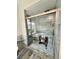 Gorgeous walk-in shower with custom tile work, a glass door, and modern fixtures at 16063 E 106Th Ct, Commerce City, CO 80022