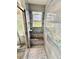Modern shower with grey tiling, mosaic accents, and a built-in bench at 16063 E 106Th Ct, Commerce City, CO 80022