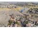 Community aerial view of home, golf course, and nearby The Ranch Country Club at 2363 Ranch Dr, Westminster, CO 80234