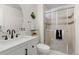 Stylized bathroom features shower, modern vanity, and updated lighting at 2363 Ranch Dr, Westminster, CO 80234