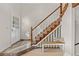 Inviting entryway with tiled floors, stairs, and bench at 2363 Ranch Dr, Westminster, CO 80234