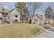 Exterior view of townhomes with well-maintained lawn and mature trees at 2363 Ranch Dr, Westminster, CO 80234