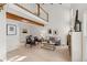 Bright living room featuring high ceilings, wood beam, wood floors, with modern furniture at 2363 Ranch Dr, Westminster, CO 80234