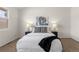 Comfortable bedroom featuring a modern art piece and lamps at 2363 Ranch Dr, Westminster, CO 80234