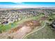Wide aerial view of the property's location within a residential community near green spaces at 10233 Silver Maple Cir, Highlands Ranch, CO 80129