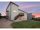 Inviting backyard featuring a well-maintained lawn and elevated deck perfect for outdoor entertaining at 10233 Silver Maple Cir, Highlands Ranch, CO 80129