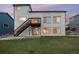 A multi-story home with outdoor stairs and backyard access at 10233 Silver Maple Cir, Highlands Ranch, CO 80129