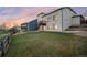 A multi-story home with an outdoor stairs and backyard access at 10233 Silver Maple Cir, Highlands Ranch, CO 80129