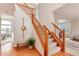 Bright foyer with a wooden staircase, hardwood floors, and neutral decor at 10233 Silver Maple Cir, Highlands Ranch, CO 80129