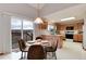 Bright kitchen features a cozy breakfast nook with views, and classic cabinetry at 10233 Silver Maple Cir, Highlands Ranch, CO 80129
