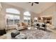 Spacious living room with large windows offering abundant natural light and neighborhood views at 10233 Silver Maple Cir, Highlands Ranch, CO 80129