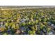 Extensive aerial view of a tree-filled neighborhood, revealing the property's location within a verdant setting at 1815 S Ogden St, Denver, CO 80210