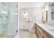 Bright bathroom featuring glass shower and granite vanity at 1815 S Ogden St, Denver, CO 80210