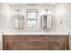 Bathroom with double sink vanity, granite countertop, and decorative wallpaper at 1815 S Ogden St, Denver, CO 80210