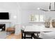 Elegant dining area with a marble-top table, stylish chairs and modern lighting at 1815 S Ogden St, Denver, CO 80210