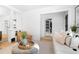 Bright living room with an open doorway, offering a seamless transition to the adjacent space at 1815 S Ogden St, Denver, CO 80210