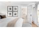 Bedroom featuring ensuite bathroom, and a modern, neutral color palette at 1815 S Ogden St, Denver, CO 80210