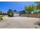 A spacious backyard with a basketball hoop and an attached two car garage at 2773 S Macon St, Aurora, CO 80014