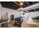 Finished basement features a pool table, play area and exposed ceiling at 2773 S Macon St, Aurora, CO 80014